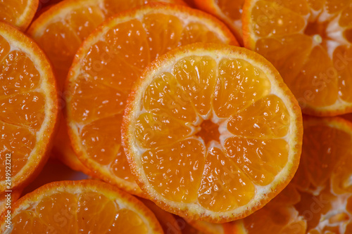 Bright orange slices showcase the juicy freshness of citrus in a vibrant display on a wooden surface