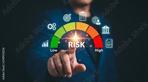 Professional business person interacting with digital risk assessment gauge interface showing low to high risk levels with various financial icons in office