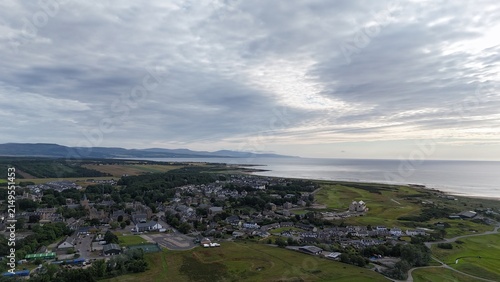 Dornoch is a historic Highland town beside Dornoch Firth, featuring a 1224 cathedral, 1509 castle, bright skies, and coastal scenery.