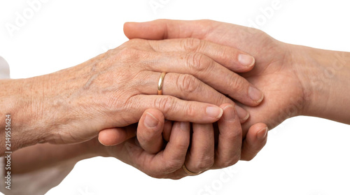 Canvas Print Elderly and young hands embrace: symbol of support and friendship across generat