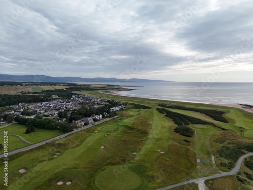 Dornoch is a historic seaside town in Scotland, overlooking the coast at sunset, with glowing skies, peaceful sea, sandy shores, and heritage.