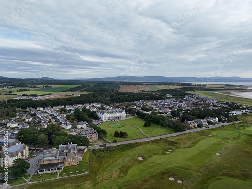 Dornoch is a historic Scottish Highland town with a 1224 cathedral, 1509 castle, charming streets, surrounding countryside, and dramatic northern skies.