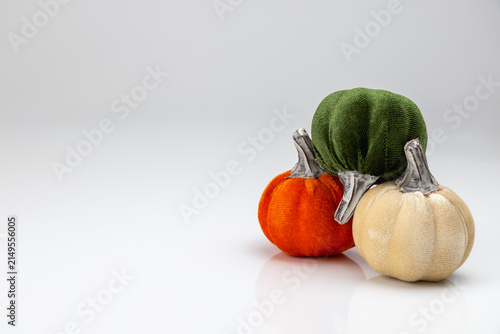 Bild auf Leinwand Decorative velvet pumpkins trio with shallow depth of field