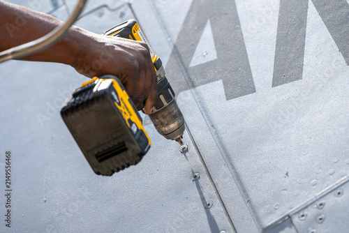 worker holding a drill