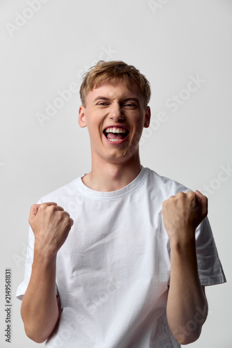 Obraz na plátne Excited, cheering, celebration, victory, happiness, young, man, expression, emot