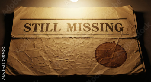 Vintage newspaper headline still missing with coffee stain