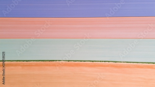 Aerial Pastel Farmland Bands in Blue Peach and Green