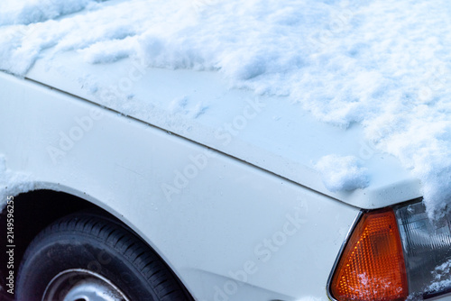 Cuadro en lienzo Side view of frozen passenger vehicle after a heavy winter snowstorm The Concept