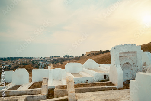 фотографія White mausoleums in historic hillside cemetery