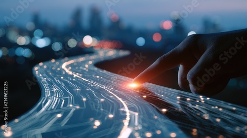 Finger touches glowing light path of digital network flow in cityscape