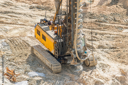 Heavy Construction Drilling Rig on Sandy Terrain