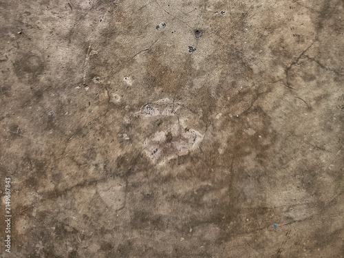 Rough textured background of a worn grey concrete surface with fine cracks, subtle stains, and an industrial polished finish.