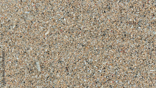 Foto detailed top down view of coarse beach sand texture with small round grains and