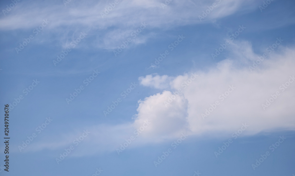 Obraz premium Unique Round Cumulus Cloud Ball in Bright Blue Sky 