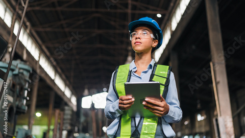 Fotografía Engineer worker factory helmet tablet safety vest inspection industry woman engi