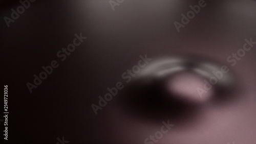 A close-up, abstract shot of a metallic surface reflecting light.