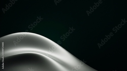 Abstract flowing silk with gentle curves against a dark background.
