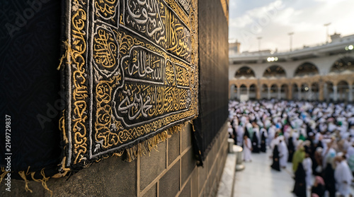 People praying inside grand mosque with ornate walls