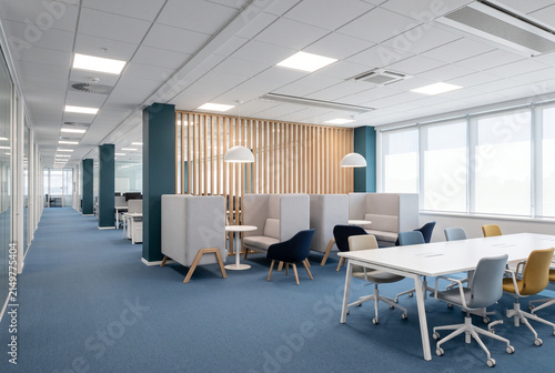 Modern office interior featuring collaborative workspace meeting table lounge seating blue carpet with bright empty contemporary furniture lounge booths