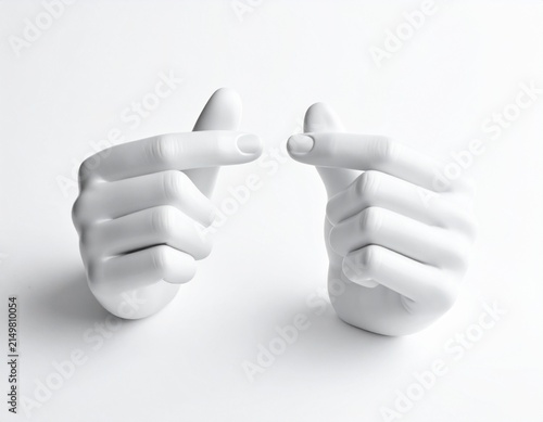 White mannequin hands pointing towards each other with fingers extended on white background