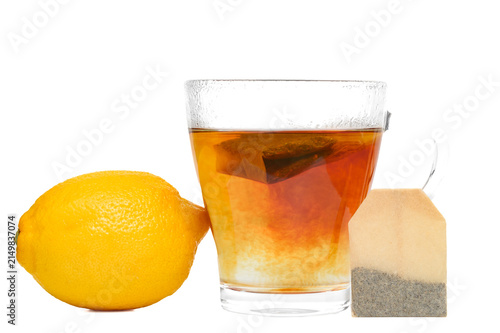 Fotografie Delicious black tea with lemon, earl grey in tea bags isolated on white backgrou