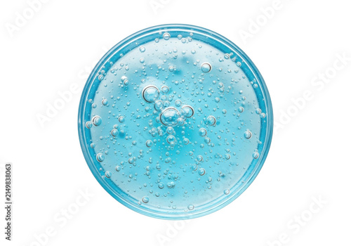 Blue cosmetic gel texture with silver glitter in a circular container