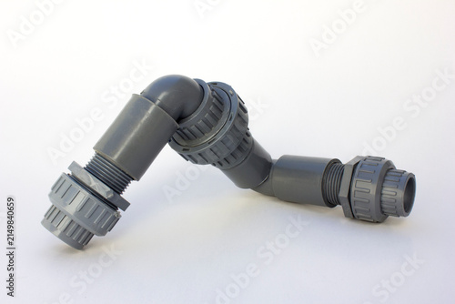 PVC thread union fitting isolated on white background. It connects two pipes or links a pipe directly to equipment like a water pump or filtration tank.