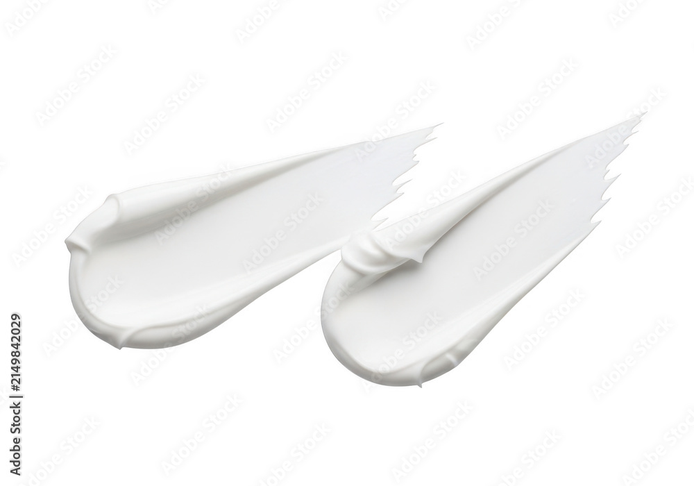 Obraz premium Two white cosmetic cream smears isolated on a transparent background