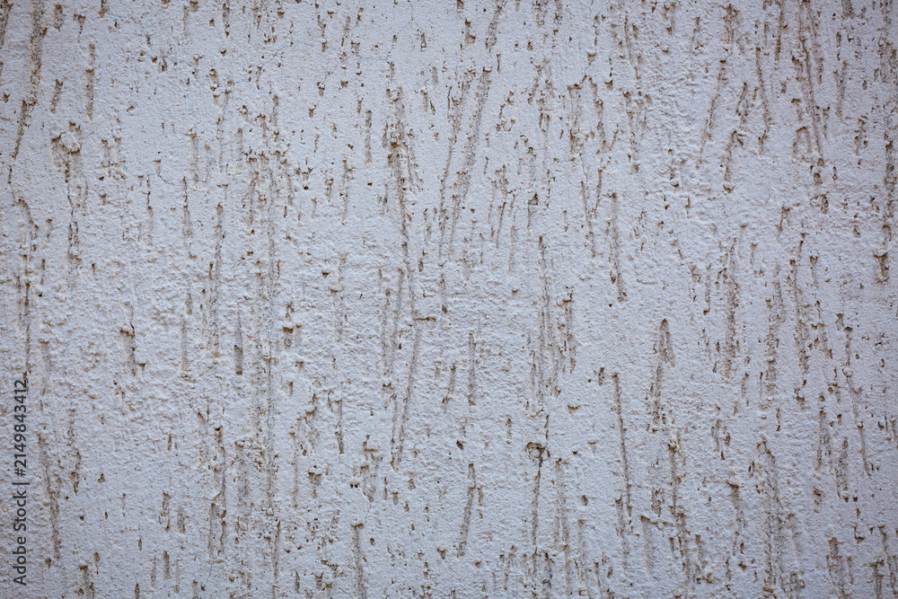 Fototapeta premium White Plaster Wall Texture with a Rough Scratched Relief Surface