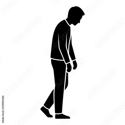 Sad man silhouette walking with slumped shoulders and downcast head.