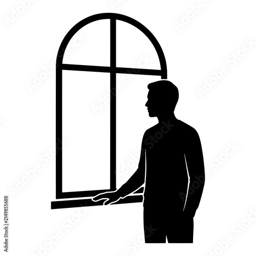 Thoughtful man looking out window silhouette contemplating future decisions.