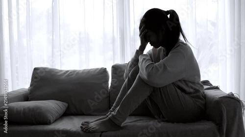 Woman suffering from depression and crying alone, representing mental health struggles, family problems, emotional abuse, stress, trauma, loneliness, and recovery.