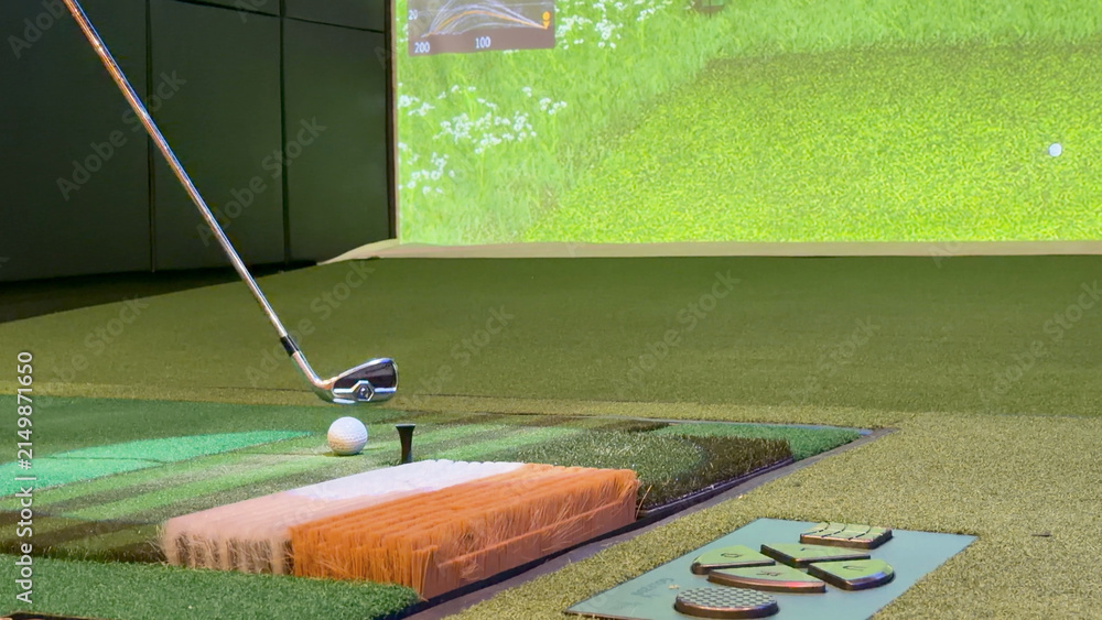 Fototapeta premium Golf Club Approaching Ball on Indoor Virtual Simulator Mat
