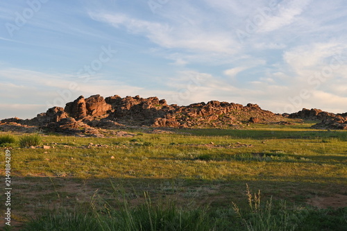 Granite rocks in Mongolian steppe during sunrise
