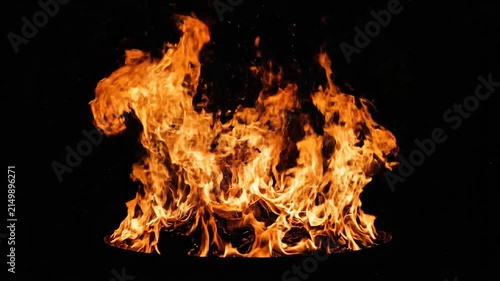 Bright orange flames burning intensely against a solid black background