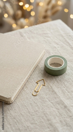 Christmas planner notebook desk washi tape on linen with warm lights for cozy writing