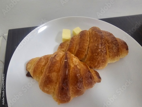 Картината върху платно croissant on a plate