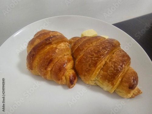 Canvas Print croissant on a plate