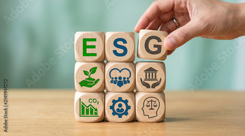 Wooden blocks spelling ESG with icons representing environmental, social, and governance factors, showcasing sustainable business concepts.