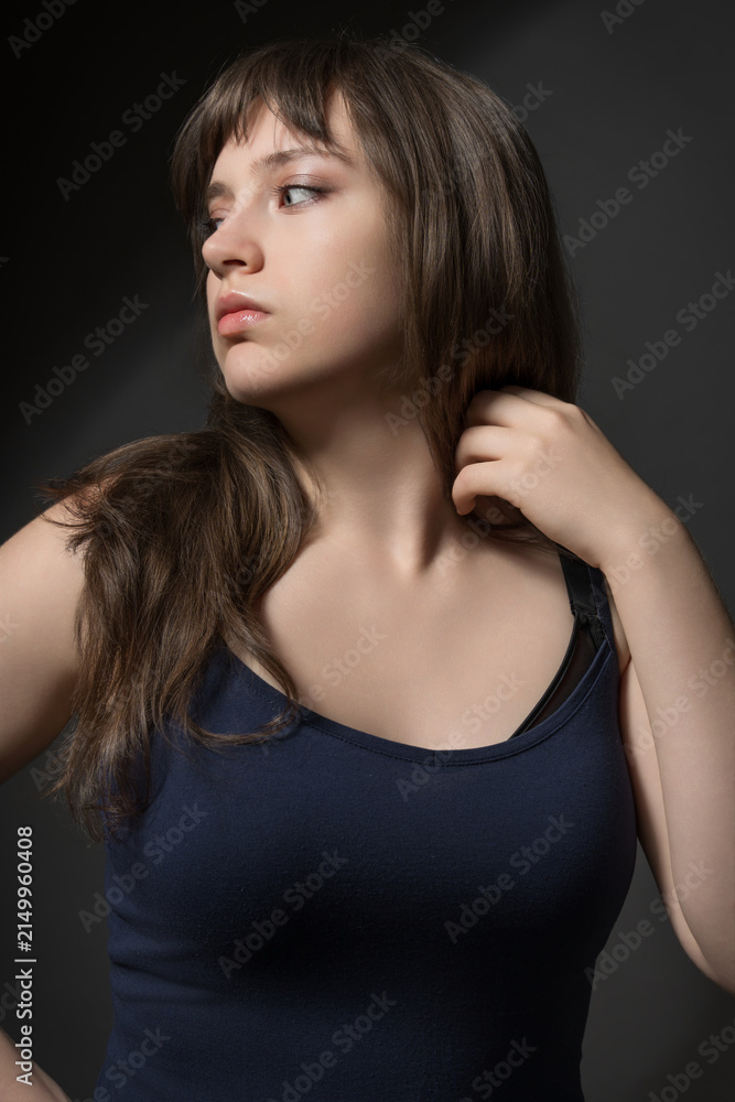 Fototapeta premium Beautiful Teenage Girl Portrait Beauty and Youth Concept on Dark Background