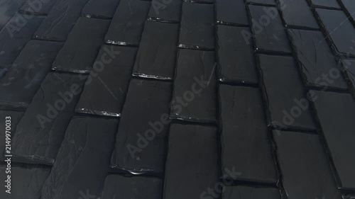 Black Slate Roof Tiles Texture in Rain Background Loop