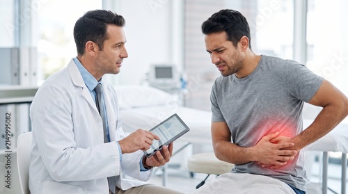 Doctor consulting a patient with abdominal pain