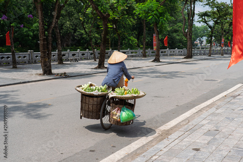 Vietnamese Street Vendor Cycling Through Son Tay, Hanoi