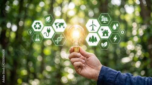 Hand holding glowing light bulb with eco icons in background