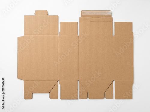 Unfolded brown cardboard box template layout for packaging design.