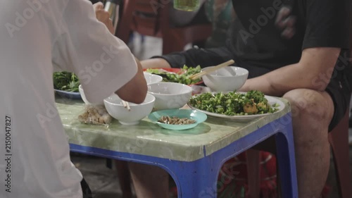 Sidewalk dining with Vietnamese street food in Hanoi