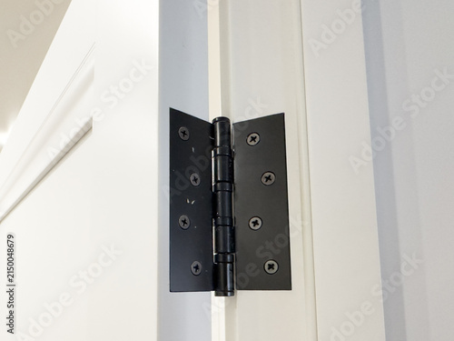Canvas Print An Up-Close View of a Modern Black Door Hinge Showcasing Its Unique Design and F