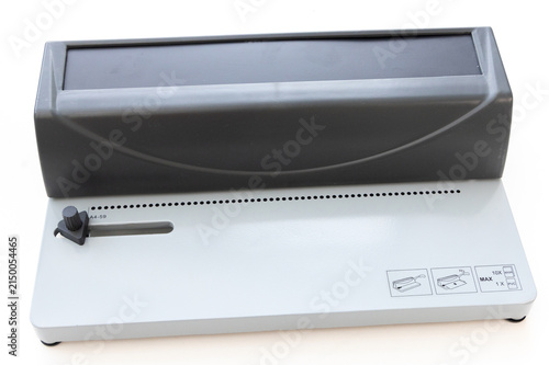 Konstfotografi Industrial heavy duty paper puncher machine on white background
