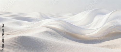 White silk fabric flowing over sand surface