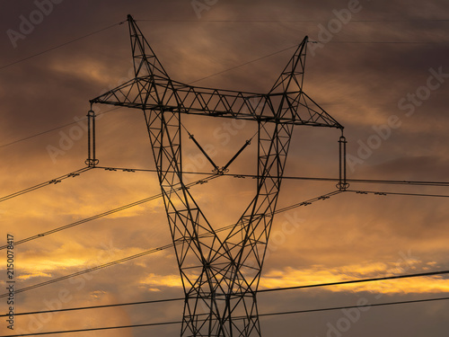 Electric pole against a summer sunset